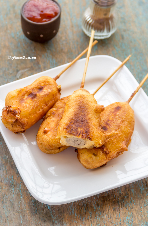 Cheesy Hot Dog on a Stick *Video Recipe* | Flavor Quotient | Crispy outside and cheesy inside, this cheesy hot dog on a stick is dangerously addictive! Make ample and see them vanish instantly!