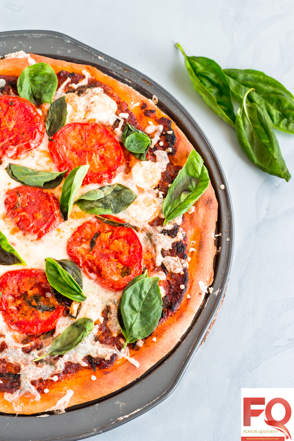 Classic Margherita Pizza from Scratch | Flavor Quotient | A classic Margherita pizza made from scratch at home could be the best thing to reward yourself and your friends & family! This homemade Margherita pizza is the best ever veg pizza I have ever tasted and with my tips & tricks below, you can bake a perfect one at your home too!