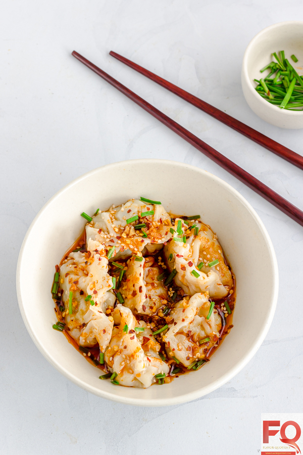 This bowl full of Sichuan chicken dumplings drizzled with spicy red sauce is simply pure culinary heaven! Once you make your own Sichuan spiced chicken dumplings at home, you will forget even the fine diners! | Easy Chicken Dumplings | Chicken Dumplings recipe | Sichuan Chicken Dumplings | Chinese Chicken Dumplings | Homemade Chicken Dumplings | Asian Chicken Dumplings | How to make Chicken Dumplings | Steamed Chicken Dumplings | Chicken Dumplings Filling